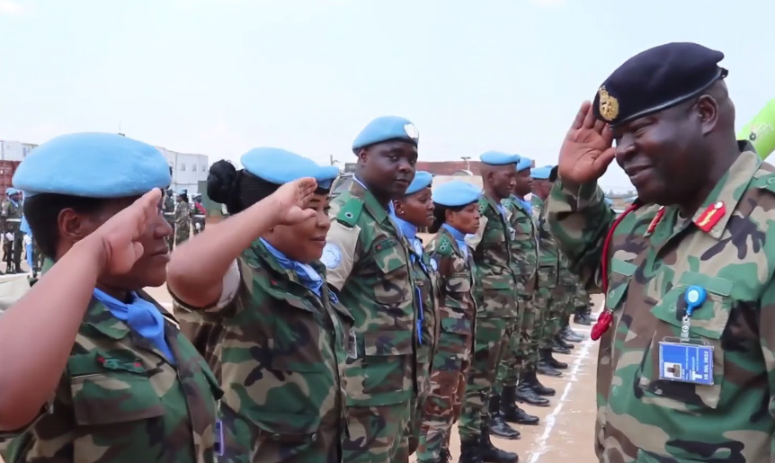 MDF Commander Paul Valentino Phiri salutes soldiers on one of the peacekeeping missions.