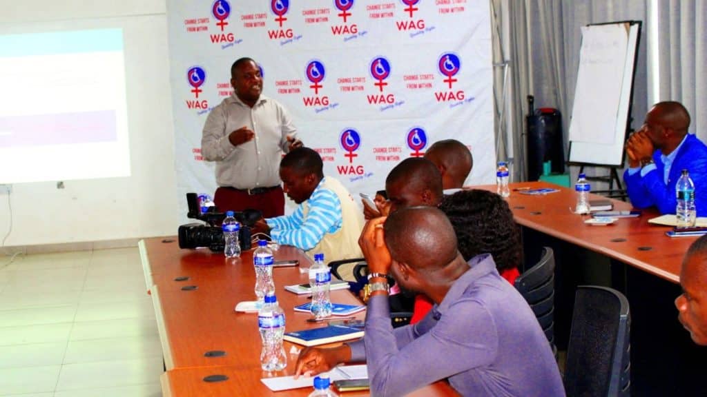 Consultant Dr George Mwika Kayange facilitating a media workshop on disability rights.